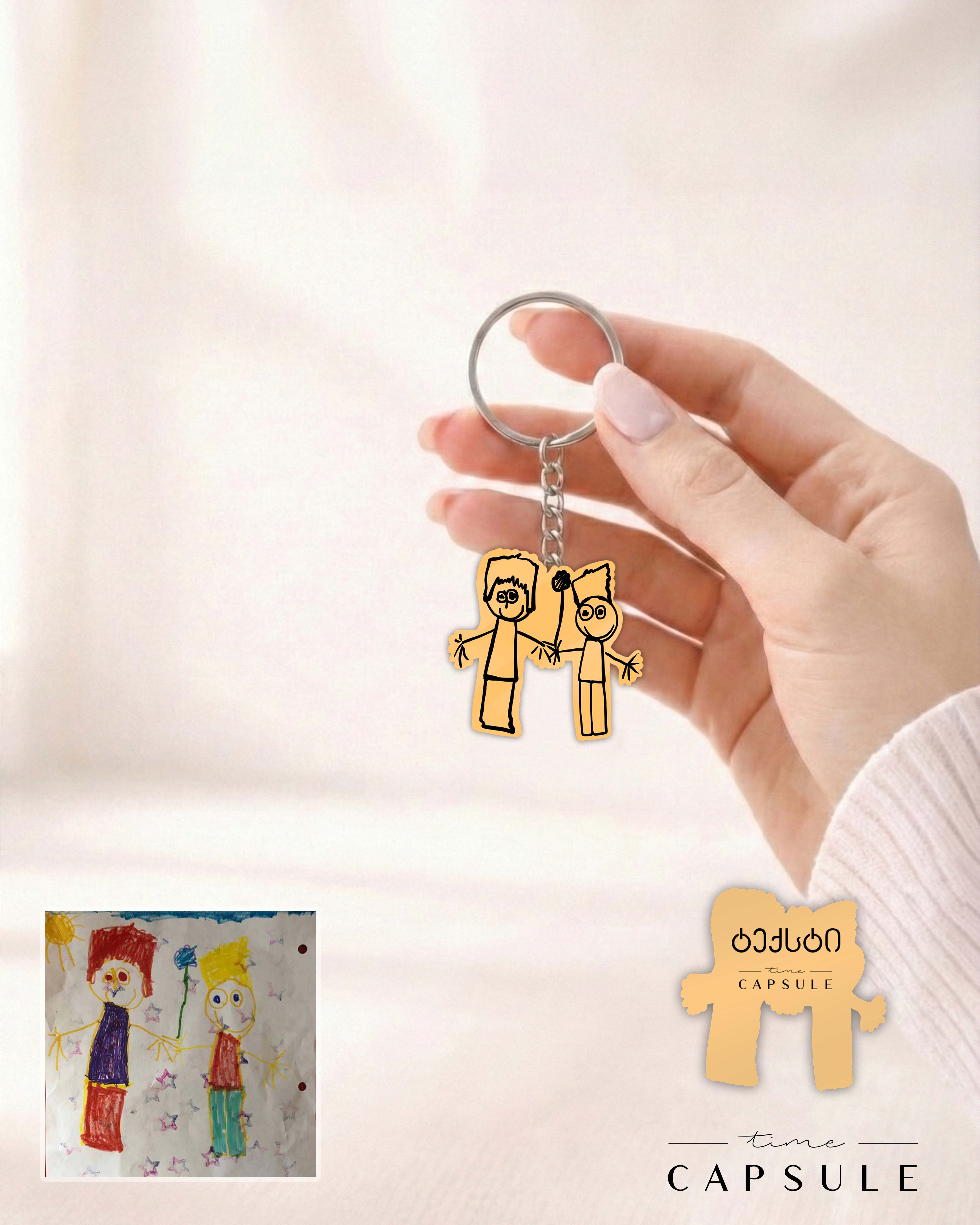 2 პერსონიანი მოოქროვილი ვერცხლის ბრელოკი ნახატიდან გრავირებით